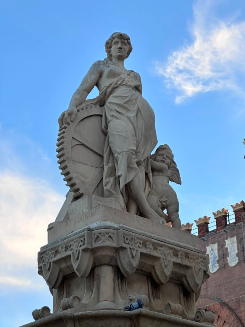 A stone sculpture against a blue sky.